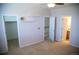 Neutral bedroom features two closets and doorways, neutral carpet, and a ceiling fan with light at 16180 E Geddes Ln # 14, Aurora, CO 80016