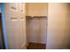 Empty closet includes shelves and a rod to hang clothes at 16180 E Geddes Ln # 14, Aurora, CO 80016