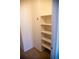 Walk-in closet features built-in shelving for storage and organization at 16180 E Geddes Ln # 14, Aurora, CO 80016
