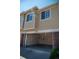 Wide garage with shelving and organization, providing convenience and functionality for parking and storage at 16180 E Geddes Ln # 14, Aurora, CO 80016