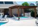 Community hot tub is located under a pergola with seating nearby at 16180 E Geddes Ln # 14, Aurora, CO 80016