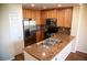 Well-equipped kitchen features stainless steel appliances, granite countertops, and ample cabinet space at 16180 E Geddes Ln # 14, Aurora, CO 80016