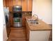 Well-equipped kitchen features stainless steel appliances, granite countertops, and ample cabinet space at 16180 E Geddes Ln # 14, Aurora, CO 80016