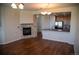 Open-concept space with a modern fireplace and seamless flow into a well-equipped kitchen at 16180 E Geddes Ln # 14, Aurora, CO 80016