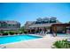 Community pool and pergola offer a relaxing outdoor space with lounge chairs at 16180 E Geddes Ln # 14, Aurora, CO 80016