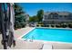 Relaxing community pool area with lounge chairs and shade trees at 16180 E Geddes Ln # 14, Aurora, CO 80016