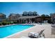 Community pool area features a hot tub under a pergola at 16180 E Geddes Ln # 14, Aurora, CO 80016