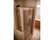 Shower with sliding glass doors featuring neutral tile, built in soap racks, and vanity at 16180 E Geddes Ln # 14, Aurora, CO 80016