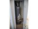 Hot water heater closet with access to the house's plumbing at 16180 E Geddes Ln # 14, Aurora, CO 80016