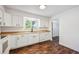 Bright kitchen features white cabinets, ample counter space, and modern appliances at 7755 E Quincy Ave # T2, Denver, CO 80237