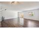 Bright living room with wood floors and a sliding glass door to the backyard at 7755 E Quincy Ave # T2, Denver, CO 80237