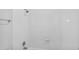 Bathroom showcasing a sleek shower with subway tile at 6455 E Bates Ave # 3-102, Denver, CO 80222