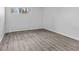 Cozy bedroom with hardwood floors and a bright window at 6455 E Bates Ave # 3-102, Denver, CO 80222