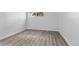 Bedroom showcasing hardwood floors, and a bright window at 6455 E Bates Ave # 3-102, Denver, CO 80222