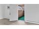 Entryway with wood floors, neutral paint, and a view to the outside stairs at 6455 E Bates Ave # 3-102, Denver, CO 80222