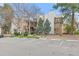 Exterior elevation of apartment building with trees and parking spaces at 6455 E Bates Ave # 3-102, Denver, CO 80222