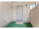A front door with fresh neutral paint opens to a modern condo space at 6455 E Bates Ave # 3-102, Denver, CO 80222