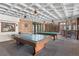 Inviting game room featuring a pool table, ping pong, and unique coffered ceilings at 6455 E Bates Ave # 3-102, Denver, CO 80222