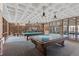 Inviting game room featuring a pool table, ping pong, and unique coffered ceilings at 6455 E Bates Ave # 3-102, Denver, CO 80222