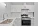 A kitchen featuring stainless appliances, white cabinets, and quartz countertops at 6455 E Bates Ave # 3-102, Denver, CO 80222
