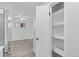 Open living space with hardwood floors, abundant natural light, and a built-in pantry at 6455 E Bates Ave # 3-102, Denver, CO 80222