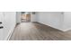 Spacious living room with luxury vinyl flooring and sliding glass door to outside patio at 6455 E Bates Ave # 3-102, Denver, CO 80222