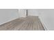 Open floor plan with luxury vinyl plank flooring, neutral paint, and baseboard heat at 6455 E Bates Ave # 3-102, Denver, CO 80222