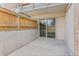 Concrete patio area featuring a sliding glass door to the home's interior at 6455 E Bates Ave # 3-102, Denver, CO 80222