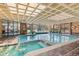 Indoor pool and spa area featuring lots of natural light and classic design elements at 6455 E Bates Ave # 3-102, Denver, CO 80222