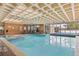 Indoor pool and spa area with lots of natural light and classic design at 6455 E Bates Ave # 3-102, Denver, CO 80222