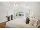 Bright bedroom boasting hardwood floors, a ceiling fan, recessed lighting, and windows with stylish shutters at 1290 S Milwaukee St, Denver, CO 80210