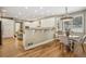 Cozy breakfast nook featuring bright light, hardwood floors, and view into the kitchen at 1290 S Milwaukee St, Denver, CO 80210