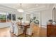 Bright dining room with hardwood floors, white trim, and view into adjacent living room at 1290 S Milwaukee St, Denver, CO 80210