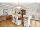 Elegant dining room with hardwood floors, tray ceilings, and classic furniture at 1290 S Milwaukee St, Denver, CO 80210