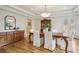 Elegant dining room with hardwood floors, tray ceilings, and classic furniture at 1290 S Milwaukee St, Denver, CO 80210