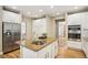 Gourmet kitchen features stainless steel appliances, white cabinets, and a large center island at 1290 S Milwaukee St, Denver, CO 80210