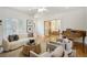Open living room with hardwood floors, fireplace, comfortable seating, and grand piano at 1290 S Milwaukee St, Denver, CO 80210