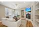 Bright living room with a fireplace, large windows, hardwood floors, and comfortable seating at 1290 S Milwaukee St, Denver, CO 80210