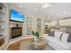 Cozy living room showcases fireplace, TV, built-in shelves, and open layout to the kitchen at 1290 S Milwaukee St, Denver, CO 80210