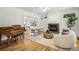 Bright living room with hardwood floors, fireplace, comfortable seating, and grand piano at 1290 S Milwaukee St, Denver, CO 80210