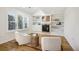 Cozy living room with hardwood floors, built-in shelving, a fireplace, recessed lights, and modern decor at 1290 S Milwaukee St, Denver, CO 80210