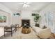 Bright living room featuring a fireplace, modern furniture, and ample natural light at 1290 S Milwaukee St, Denver, CO 80210