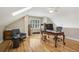 A well-lit home office featuring hardwood floors, vintage desk, and a comfortable sitting area at 1290 S Milwaukee St, Denver, CO 80210