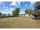 Large, grassy backyard perfect for outdoor activities, with trees and wooden fence at 7550 Raleigh St, Westminster, CO 80030