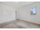 Simple bedroom with carpet, white walls, and a window to the outside at 7550 Raleigh St, Westminster, CO 80030