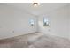 Comfortable bedroom featuring neutral carpet and double windows at 7550 Raleigh St, Westminster, CO 80030