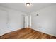 Bright bedroom with hardwood floors, white walls, and closet at 7550 Raleigh St, Westminster, CO 80030