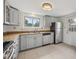 Updated kitchen with stainless steel appliances, granite countertops, and tile flooring at 7550 Raleigh St, Westminster, CO 80030
