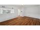 Open living room featuring hardwood floors and large opening to view the kitchen at 7550 Raleigh St, Westminster, CO 80030
