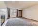 Inviting living room with cozy fireplace and bright natural light from large windows at 6755 S Field St # 606, Littleton, CO 80128